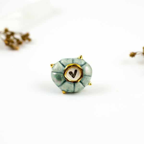 Organic shape blue color brooch with a platinum heart