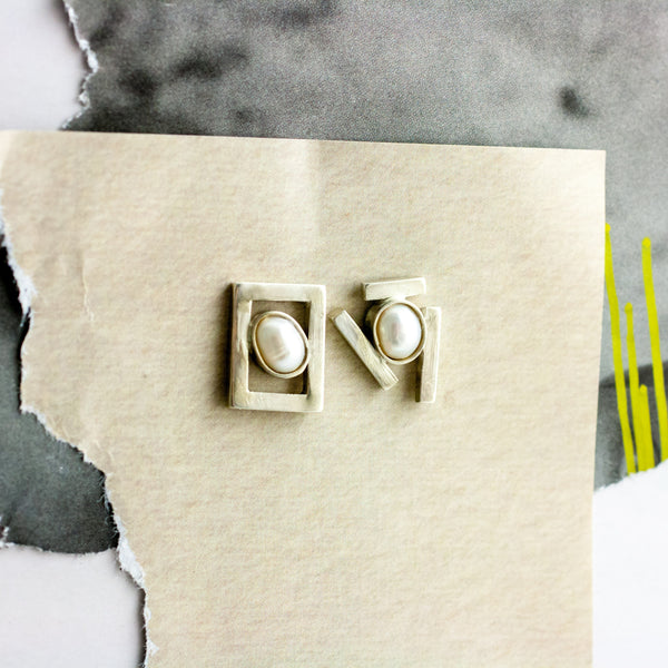 Mismatched silver stud earrings with pearls