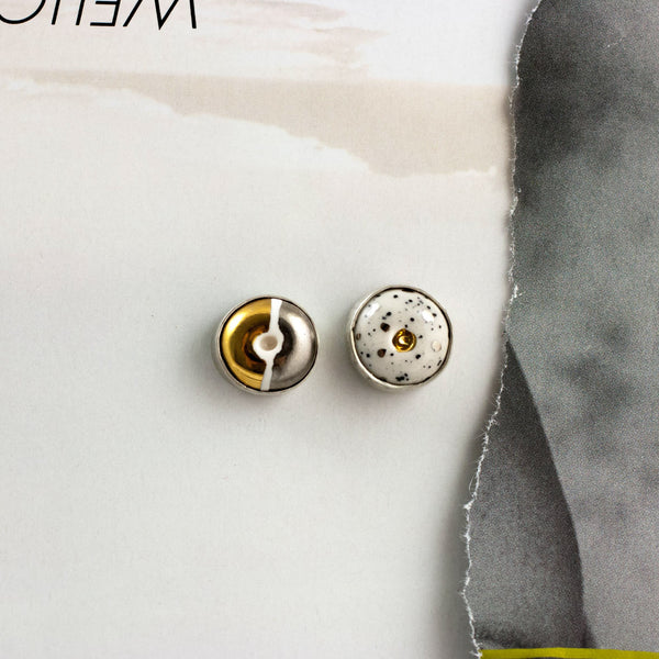 ABSTRACT White speckled mini stud earrings with lusters