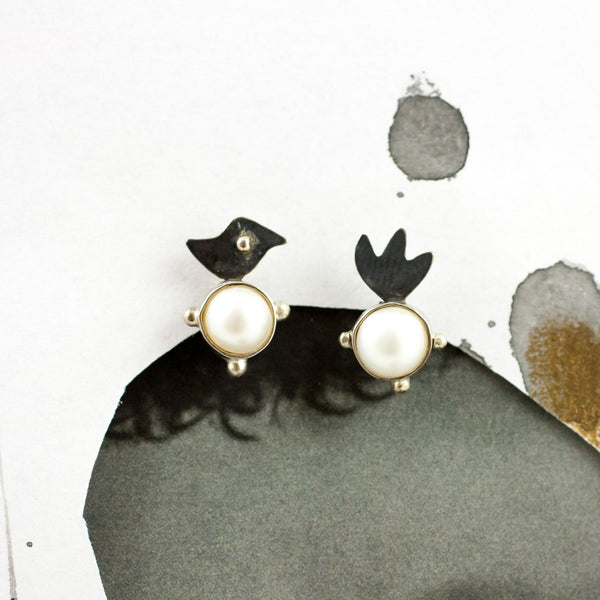 Blackened silver stud earrings with white round pearls