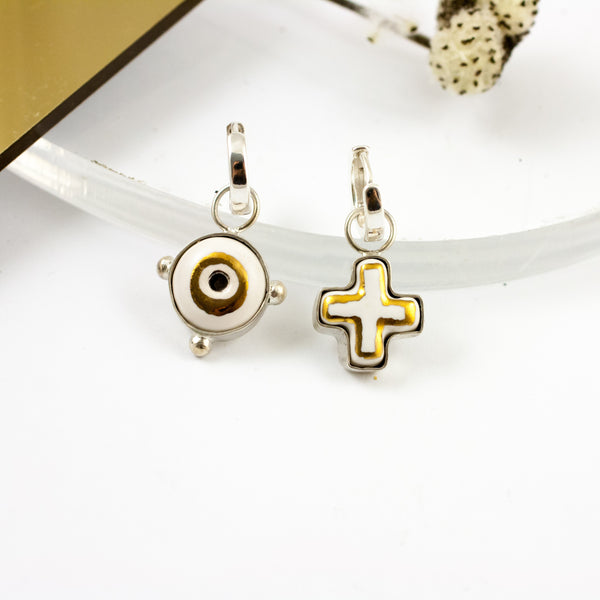 White and gold mismatched dangle earrings with ceramics