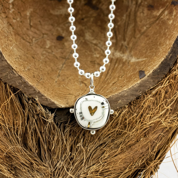 BON BON White graphic silver pendant with a heart