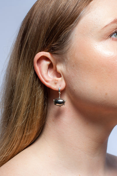DROPS mismatched dangle earrings with platinum luster