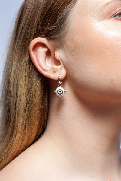 White and gold mismatched dangle earrings with ceramics