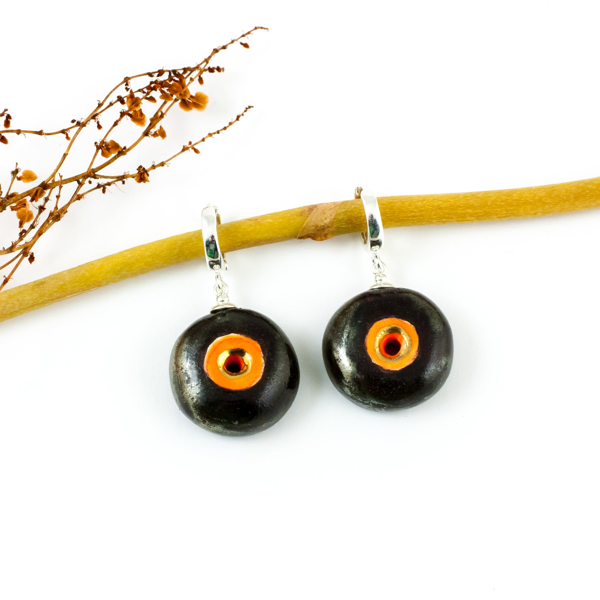 Black and orange BON BON dangle earrings