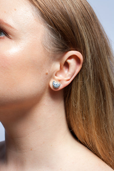 Grey asymmetrical flower and heart silver stud earrings