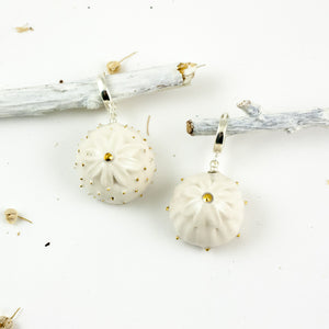 White organic form dangle earrings with dots