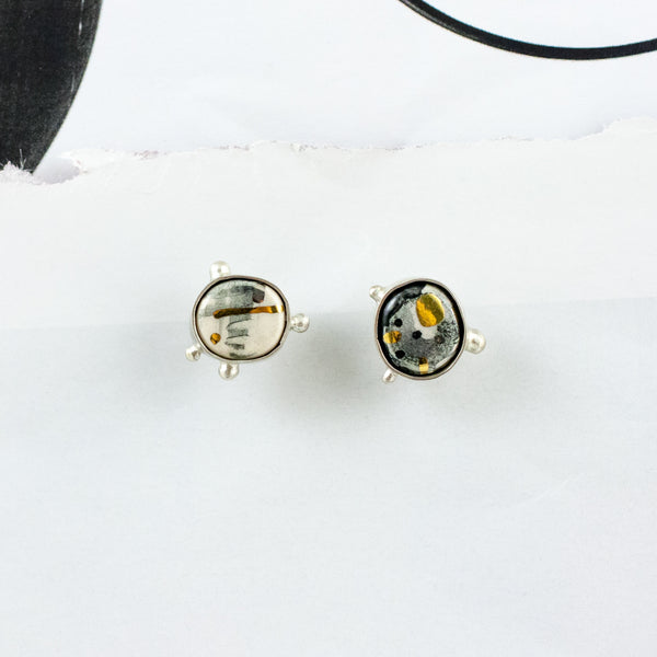 ABSTRACT Mismatched mini stud earrings