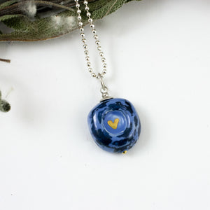 Dark blue mini pendant with a golden heart