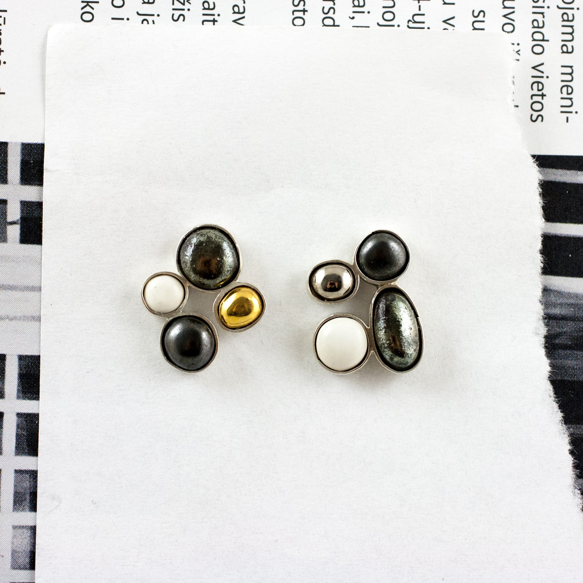 Mismatched ceramic earrings with gold and platinum