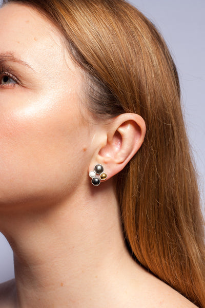 Mismatched ceramic earrings with gold and platinum