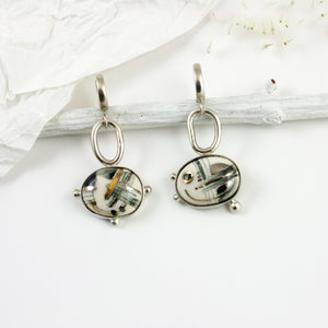 ABSTRACT White geometrical micmatched silver earrings