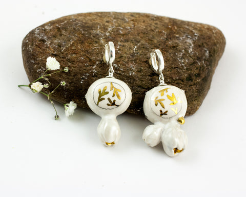 White organic form dangle earrings with flowers