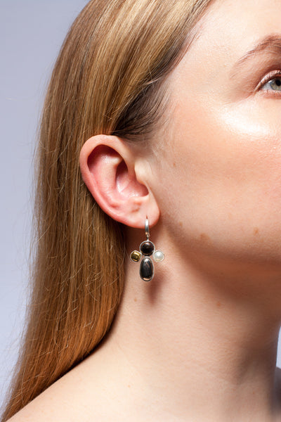 Earrings with fine metal lusters and freshwater pearls
