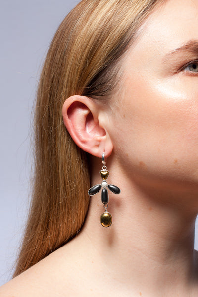 Dangle mismatched earrings with platinum and gold lusters
