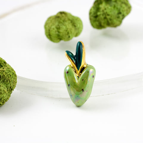 Bright green heart-shaped brooch with gold crown