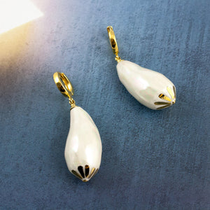 White dangle earrings with gold flowers