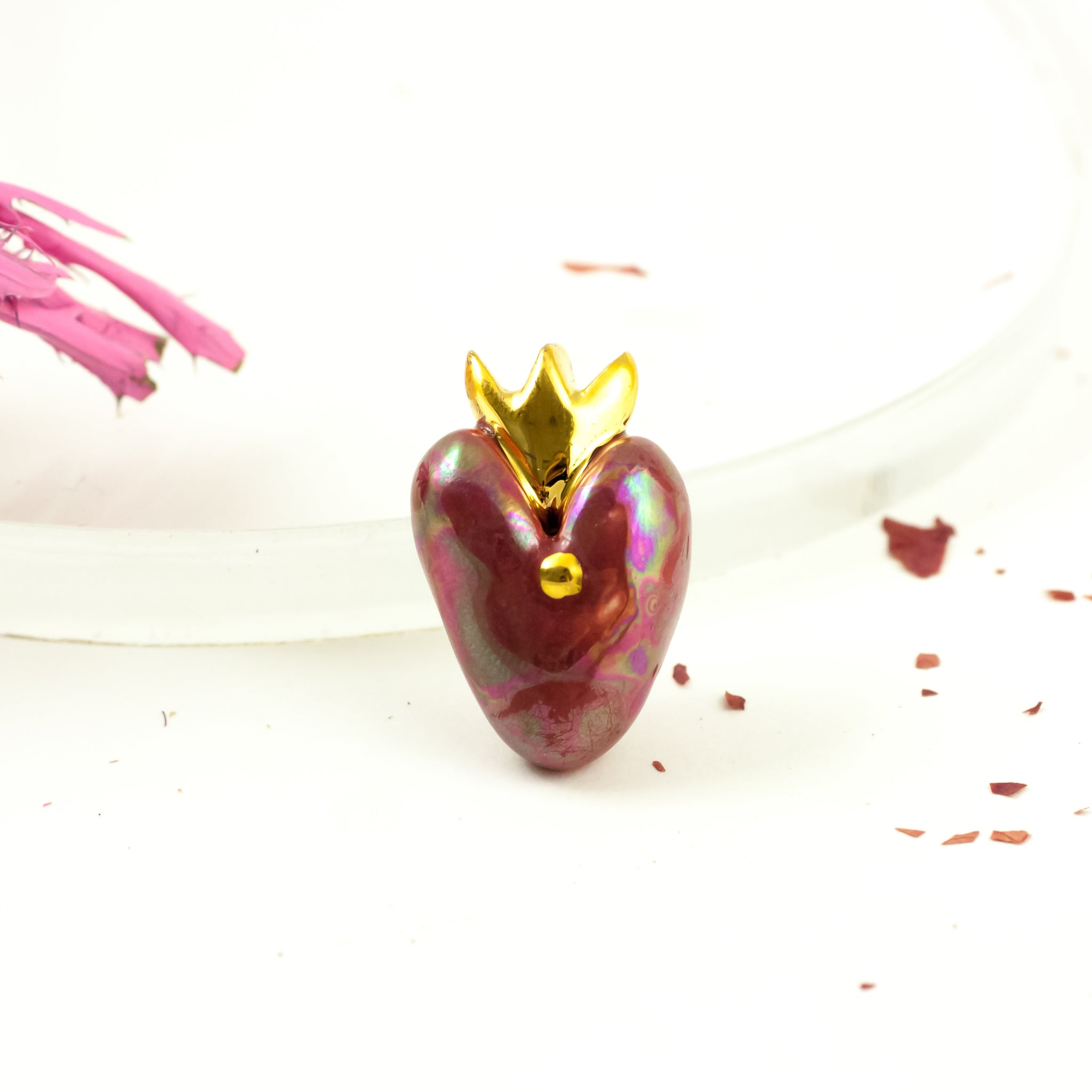 Dark red heart-shaped brooch with a crown and gold dot