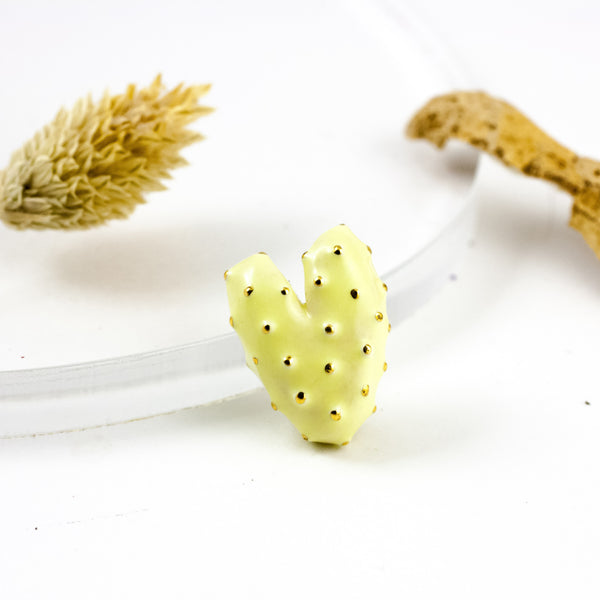Yellow heart-shaped brooch with gold dots decor