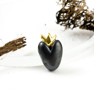 Black heart-shaped brooch with gold crown