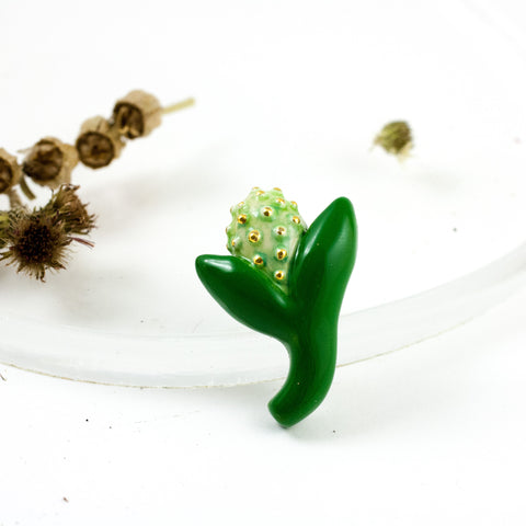 Green flower bud brooch with gold dots