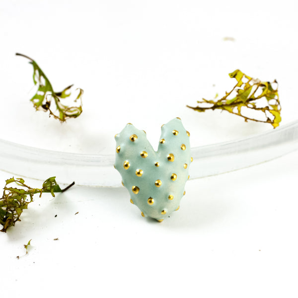 Mint heart-shaped brooch with gold dots decor