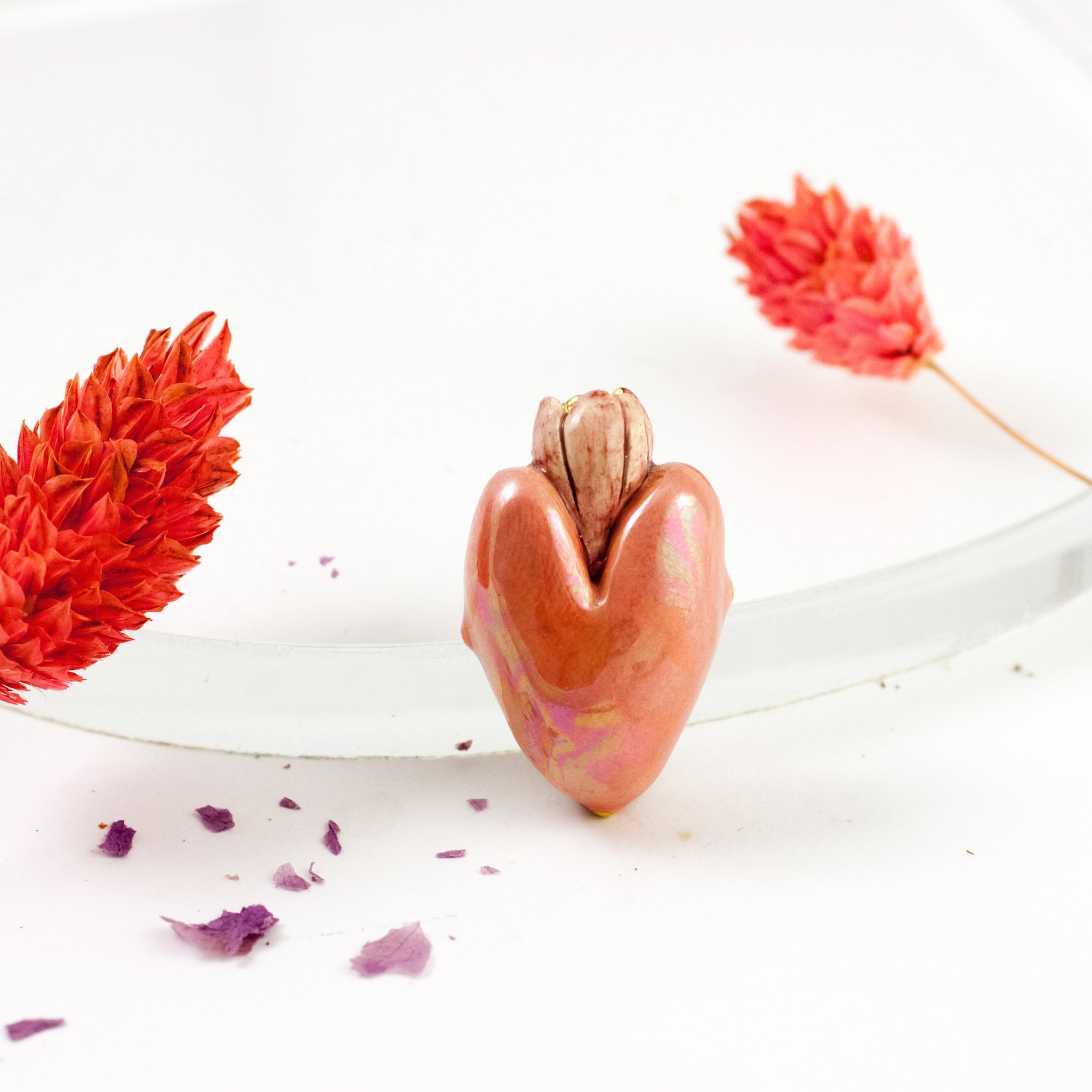 Bright red heart-shaped brooch with gold luster