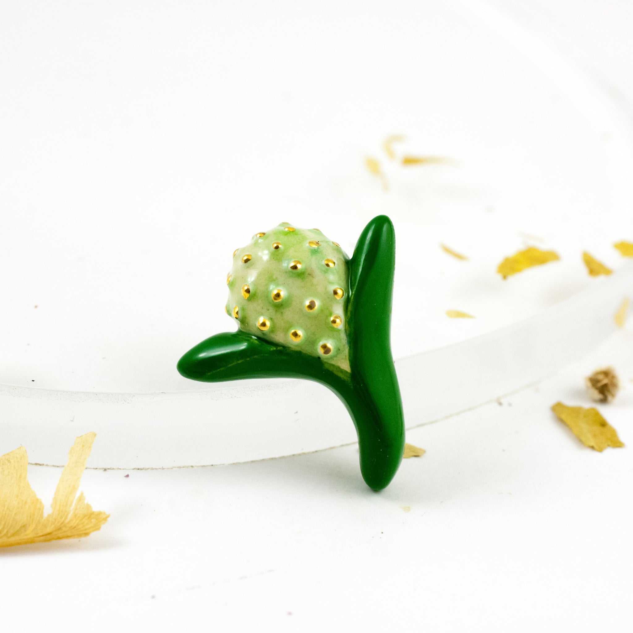Green color brooch with pearl luster and gold luster spots