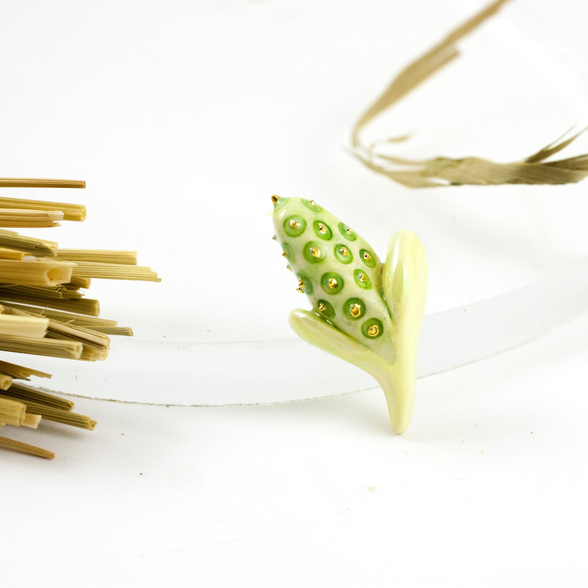 Yellow and green flower bud brooch with gold dots