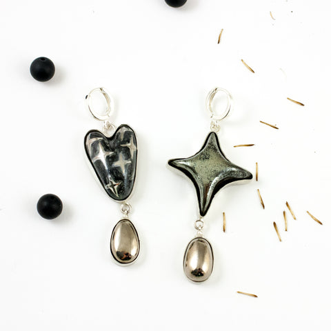 DROPS long mismatched dangle earrings with a star