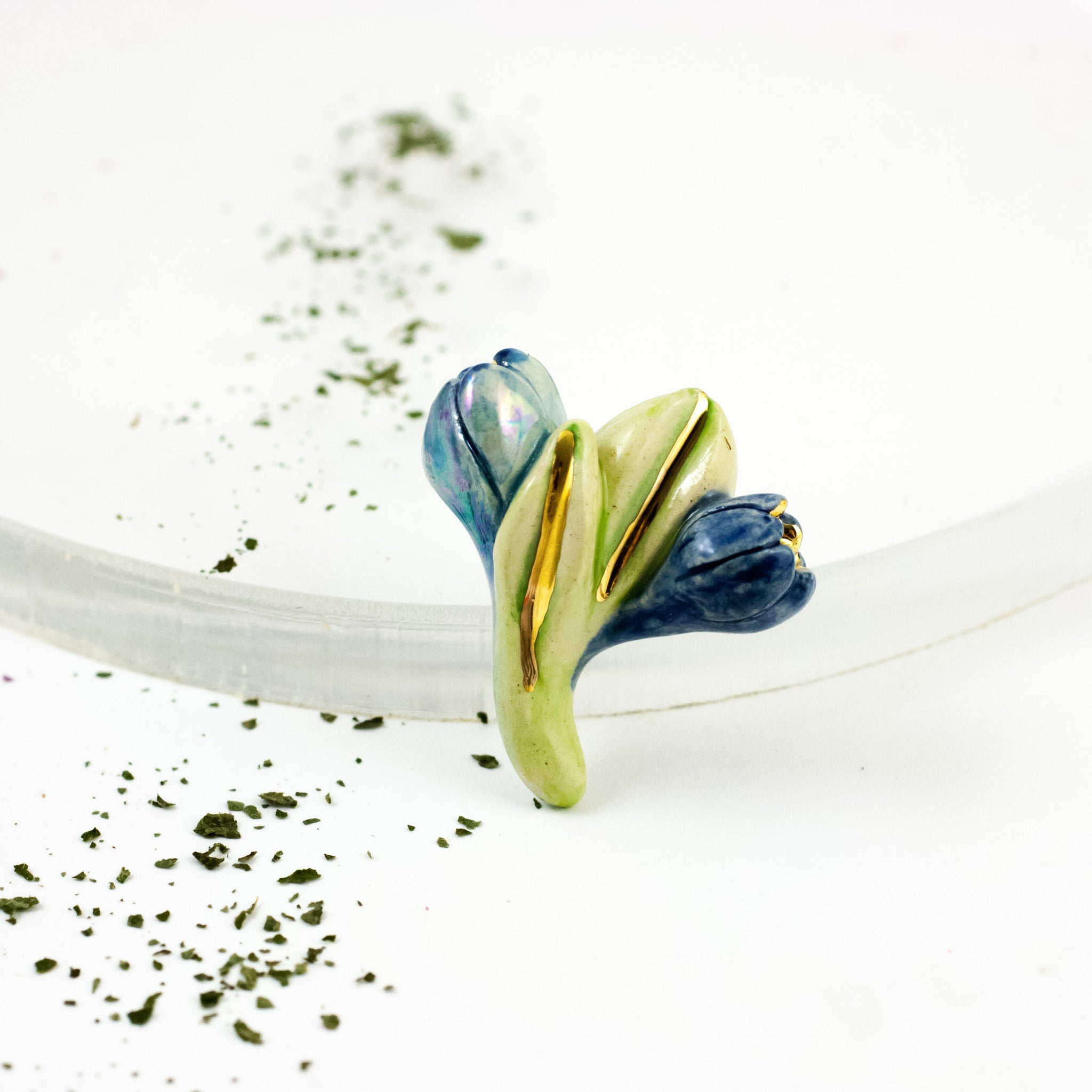 Green and blue organic brooch with gold luster details