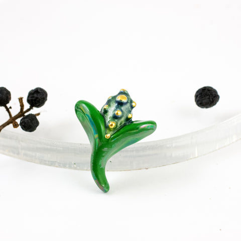 Green color flower bud form brooch with gold decor spots