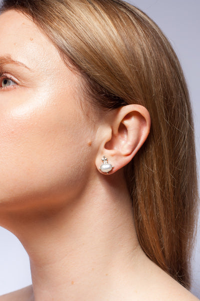 Mismatched stud silver earrings with freshwater pearls
