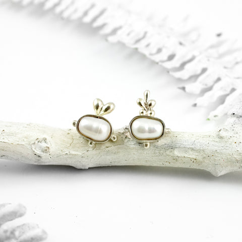 Mismatched stud silver earrings with freshwater pearls