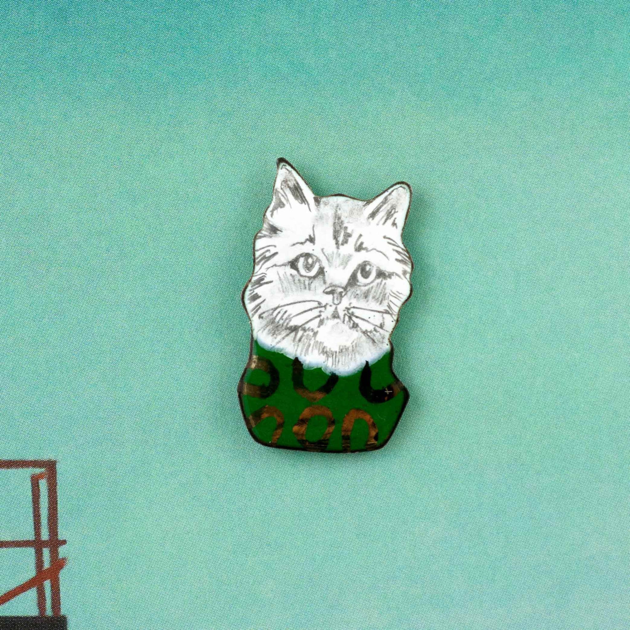 Enamel pin Cat with a green sweater - Aiste Jewelry